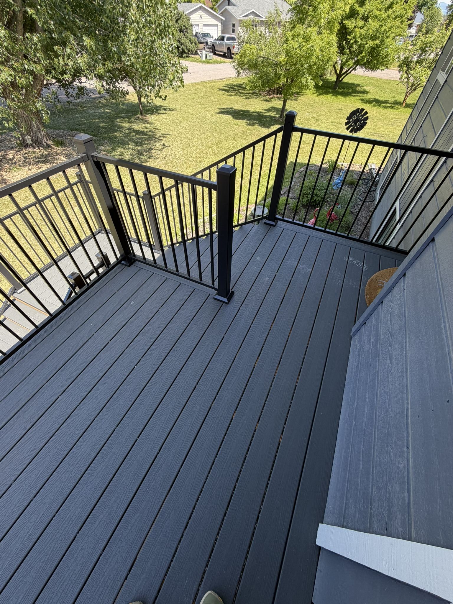 Black metal deck railing installed on a composite deck