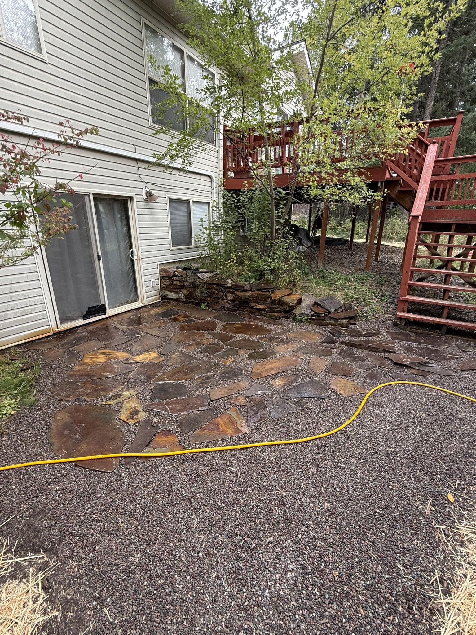 Flagstone patio and exterior site work at a Montana home